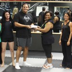 Bootcamp presents cheque to Cayman Crisis Centre