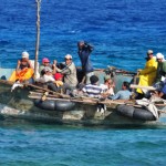 How should Cayman handle Cuban migrants?