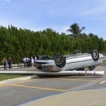 BMW flips in morning rush hour