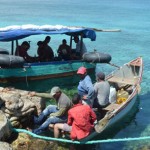 Five Cuban migrants wait to go home