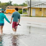 Heavy rains flood roads, threaten homes