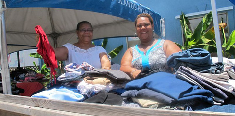 Margaret McLaughlin and Siri Russell volunteered to help sort through donations at CayBrew on Saturday.