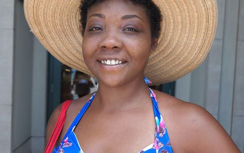 Tamika Burton stands in front of Kirk Freeport after arriving on Carnival Magic.
