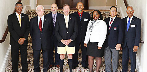 Bermuda Premier Michael Dunkley, fourth from left, in Bermuda shorts