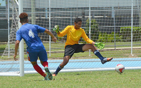 Callhan Studenhofft tries to save a shot by Corey Mellaneo in training.