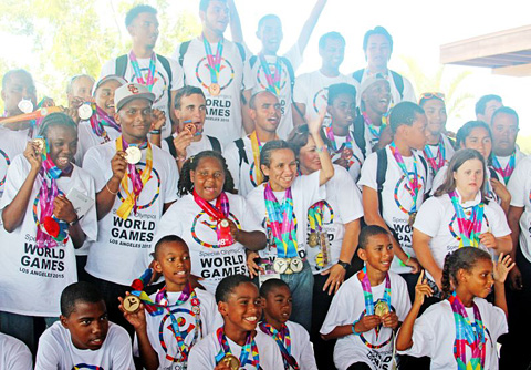 The athletes show off their medals. - PHOTOS: RON SHILLINGFORD