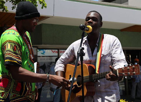 Singer Andy Blake performs a medley of music by Jamaican artists like Bob Marley.