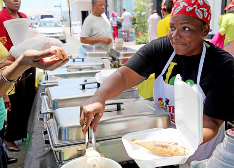 Darcia Barrett from Top Taste serves Jamaican food.
