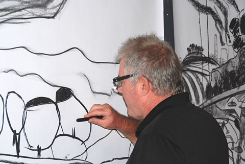 David Bridgeman adds details to one of his works.