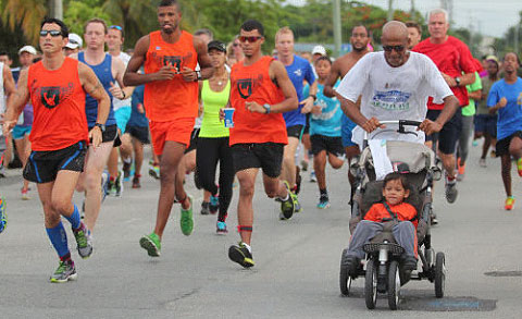 Marlon Crowe Sr., right, set off alongside Flashy Nation Sports Club runners last year.