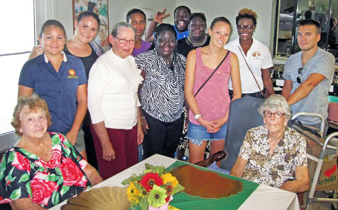 Members of Rotaract Blue with Pines residents.