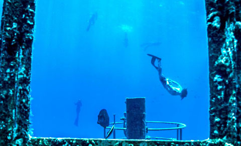 A free diver swims by the wheelhouse of the wreck. – PHOTO: NINA BAXA