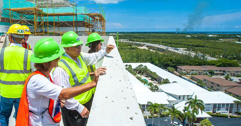 Visitors to the Kimpton Hotel site survey the view from the top floor. – Photo: Taneos Ramsay