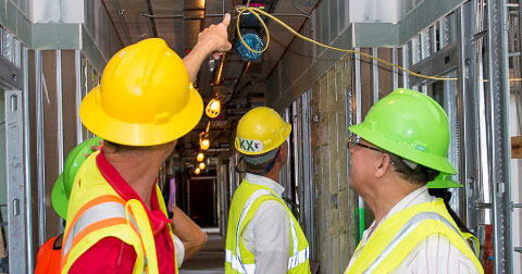 DECCO Project Manager Lee Hudson explains features of the new Kimpton hotel to MLA McKeeva Bush.