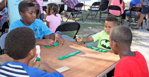 A new generation enjoys the traditional game.