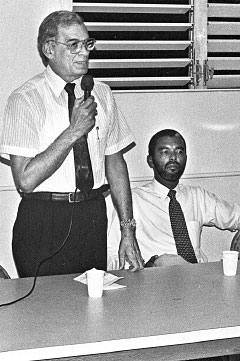 Haig Bodden, standing, wtih Roy Bodden during a meeting in 1994. – Photo: File