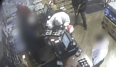 Security camera footage caught the robbery in progress. The faces of innocent bystanders have been pixelated in this image.