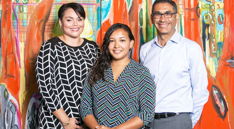 Scholarship recipient Leanni Tibbetts, center, with Joanna Virtue-Markman and Mike McWatt of Butterfield Bank.