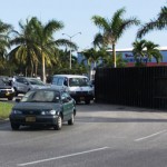 Truck loses container on roundabout