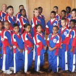 Purple Dragon kids display world championship medals to Bodden