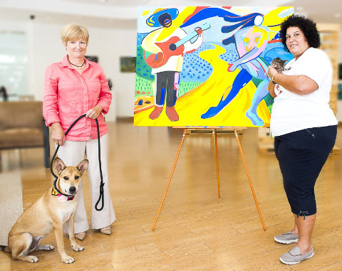 Lesley Walker, a Humane Society director, left, with shelter dog Odie, and Letty Blanco, the shelter