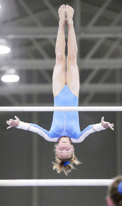 Peene shows her talent on the bars.