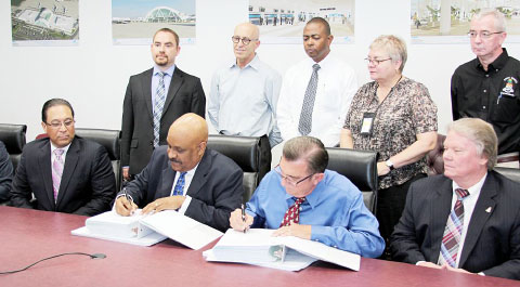 Cayman Islands government and private sector leaders were on hand Monday to witness the signing of a $3.6 million construction contract