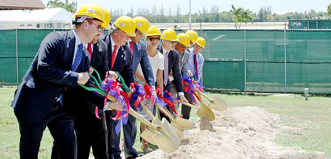Governor Helen Kilpatrick, center, joined by Premier Alden McLaughlin, fourth from left, and members of government and the private sector involved in the airport expansion break ground