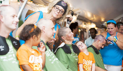 The Meeson family, center, has plenty of support at the head-shaving event, now in its third year. – PHOTOS: TANEOS RAMSAY