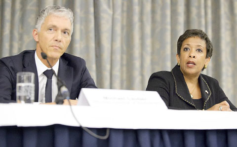 Michael Lauber, attorney general of Switzerland, and Loretta Lynch, attorney general of the United States, speak at a news conference Monday in Zurich, Switzerland, on football-related investigations.