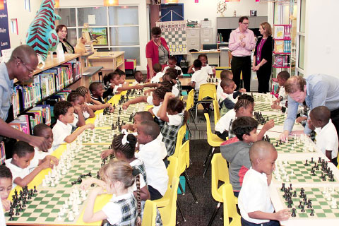 Students at George Town Primary School are introduced to chess during the launch of a pilot program in Cayman government schools by Shaun Tracey of the Cayman Islands Chess Association.