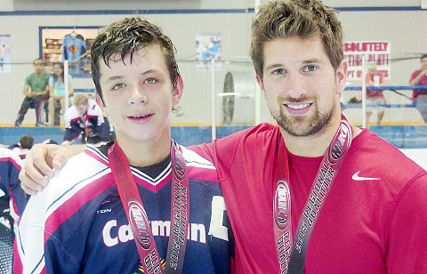 Ethan Finlason with coach Evan Ellbogen.