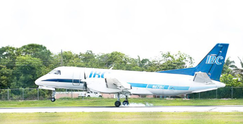 An IBC cargo plane touches down at Owen Roberts International Airport Monday after reporting a problem with its landing gear. - Photo: Taneos Ramsay