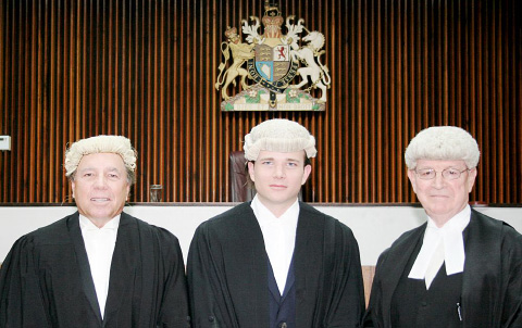 Attorney Travis Ritch, center, with his father, David Ritch, left, and Justice Charles Quin. - Photo: Carol Winker