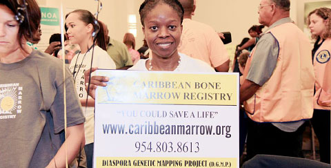 Nurse practitioner Joanna Dunk promotes the Caribbean Bone Marrow Registry at the Cayman Islands Cancer Society’s Conquering Cancer health fair on Saturday.