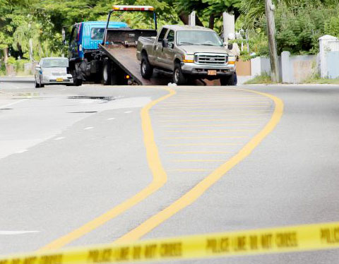 The truck that was involved in the collision is towed from the scene where a cyclist was killed Friday evening in Savannah. - Photo: Brent Fuller