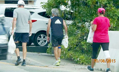 The Royal Cayman Islands Police Service issued photographs of the three people acting ‘suspiciously’ by depositing a white powder on the streets and sidewalks in George Town.