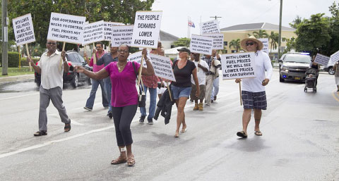 Demonstrators march from the Glass House to the Legislative Assembly Wednesday morning to protest high gas prices. - Photos: Kelsey Jukam