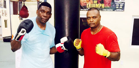 Police officer Michael ‘Bobby’ Peart and MLA Alva Suckoo get ready for their fight Saturday night.