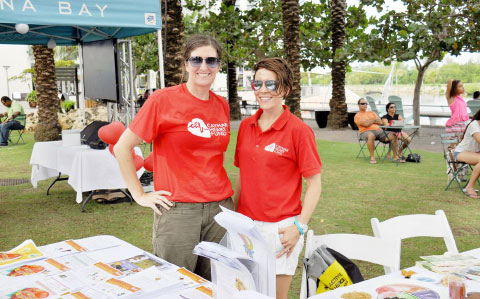 Dieticians Simone Sheehan, left, and Kristen Lomas work the Health Services Authority booth at the World Heart Day celebration last month.