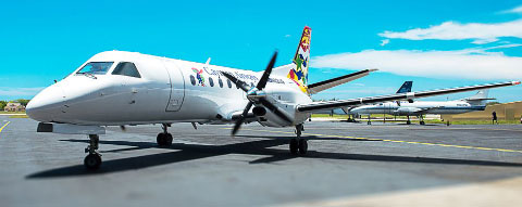 Tourism Minister Moses Kirkconnell said the Saab 340/B plus, will soon be flying on the scheduled routes between Grand Cayman and the Brac. - Photo: Taneos Ramsay
