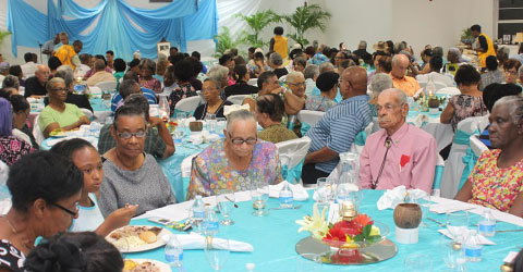 Seniors enjoy a bash put on by the Department of Children and Family Services at the Bodden Town Civic Centre. – Photo: Jewel Levy