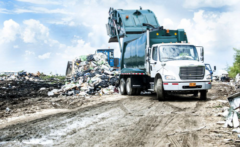 A garbage truck dumps rubbish at the top of the George Town landfill on Monday. The government has released its draft National Solid Waste Management Strategy for public consultation.