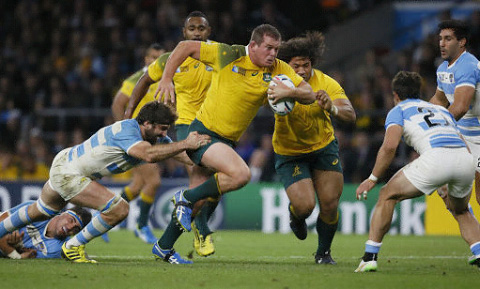 Toby Smith breaks from a tackle for Australia against Argentina on Sunday. – PHOTO: AP
