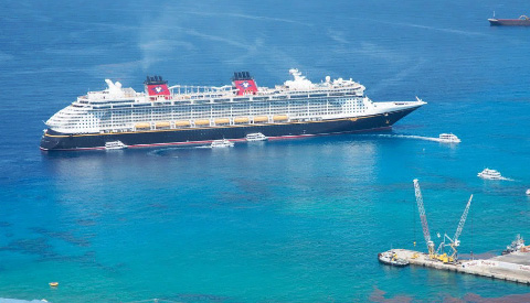 Tenders cater to a cruise ship in George Town harbor. Cruise lines have informed the Cayman Islands Ministry of Tourism that their mega-ships will not use tenders. – PHOTO: OCEAN FRONTIERS