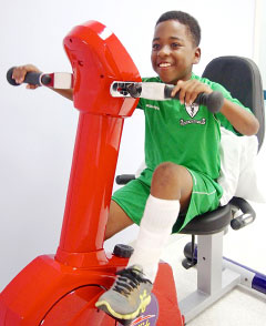 Davon Hurlston, 9, tries out the exercise bike at the Cayman Islands Hospital
