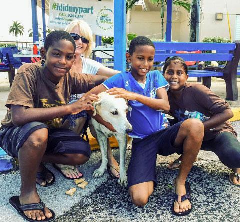 Volunteers (from left) Jevaughno Zelaya, Carol MacDonald, Jahmoll Watson and Jemma Watson had lots of fun at the Cayman Animal Rescue Enthusiasts community dog wash on Oct. 25.