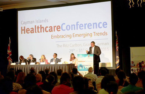 Deputy Governor Franz Manderson addresses the audience at Thursday night’s opening of the 2015 Cayman Islands Healthcare Conference at The Ritz-Carlton, Grand Cayman. – PHOTO: MAGGIE JACKSON