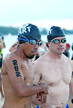 Triathletes made a dash for the water at the start.