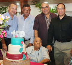 Stella Welcome celebrates her 100th birthday with government officials, from left, Acting Governor Franz Manderson, East End MLA Arden McLean, Minister Osbourne Bodden and Premier Alden McLaughlin.